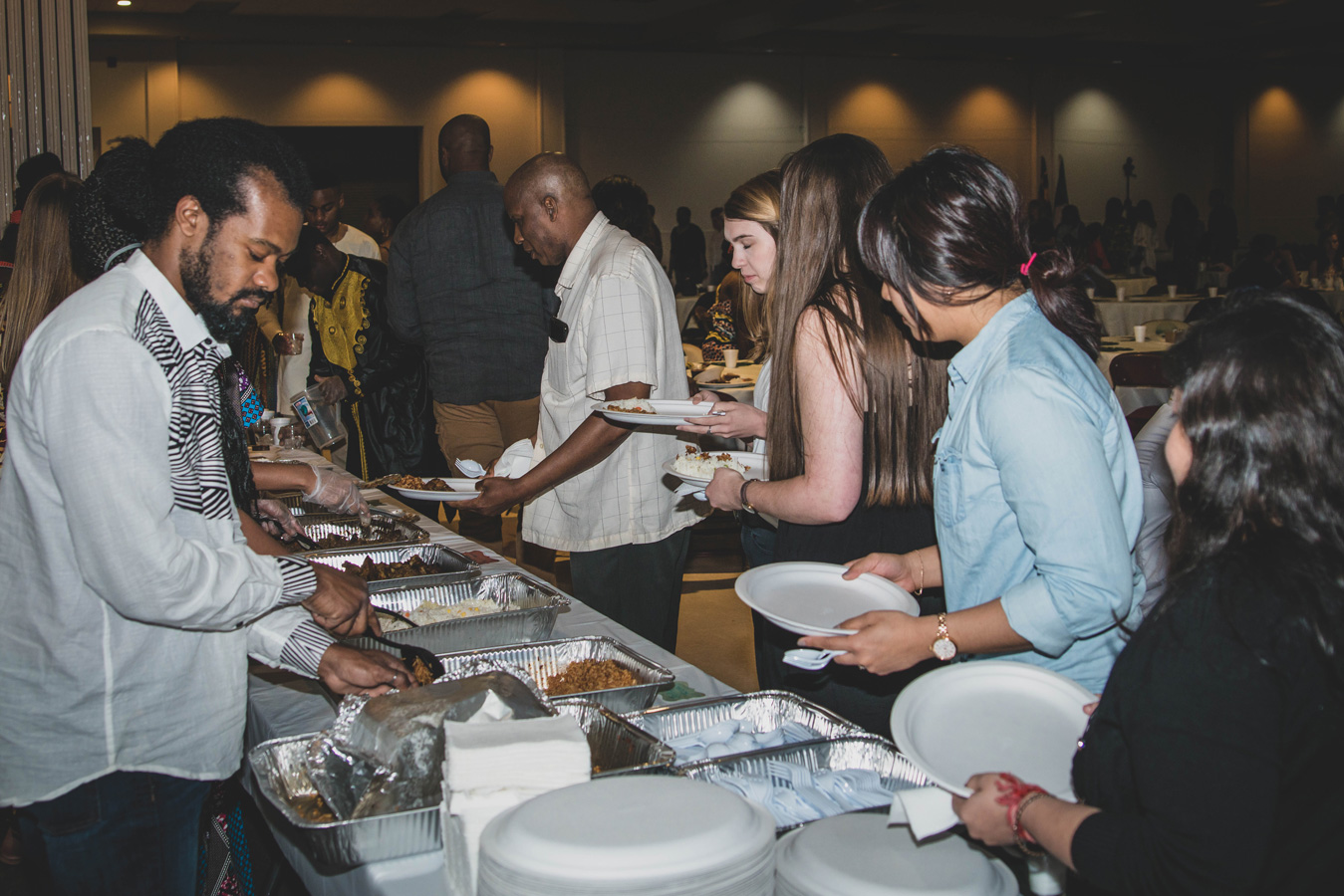 People lined up a buffet at African MegaFest