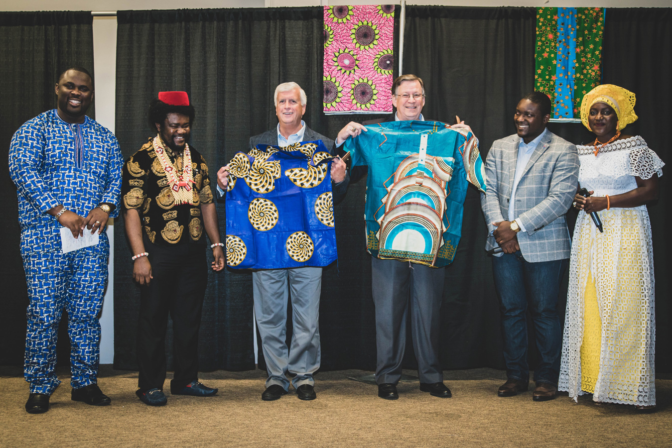 Ruston Mayor Ronny Walker and Tech President Dr. Les Guice with African MegaFest shirts on stage