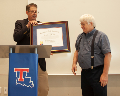 Dean Hegab giving Dr. Cox an award for his dedication to Louisiana Tech