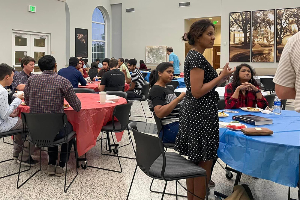 Graduate students and Sylvia Shultz enjoying conversation at the 2022 Fall Festival