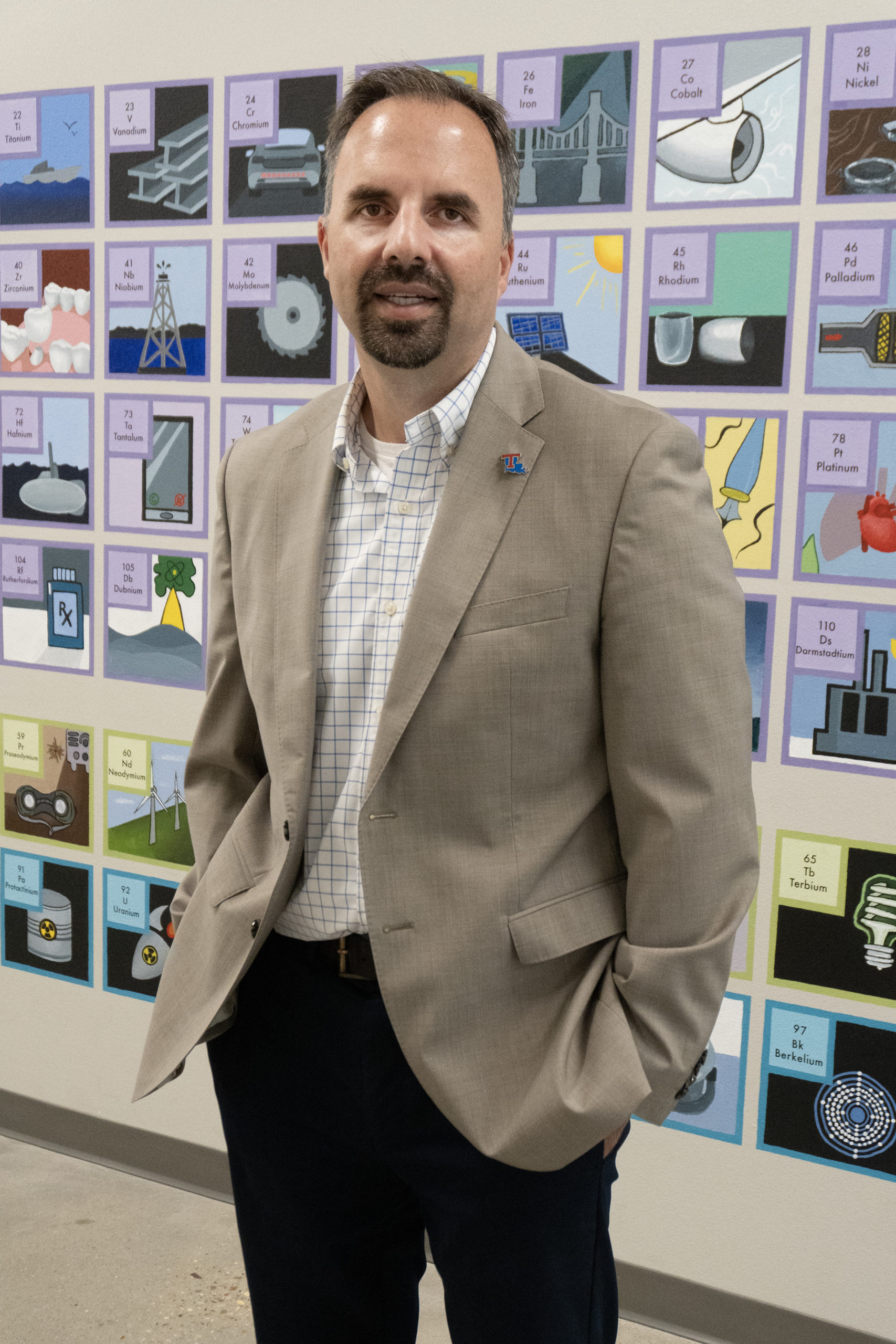 COES Dean Dr. Collin Wick standing in front of the Periodic Table